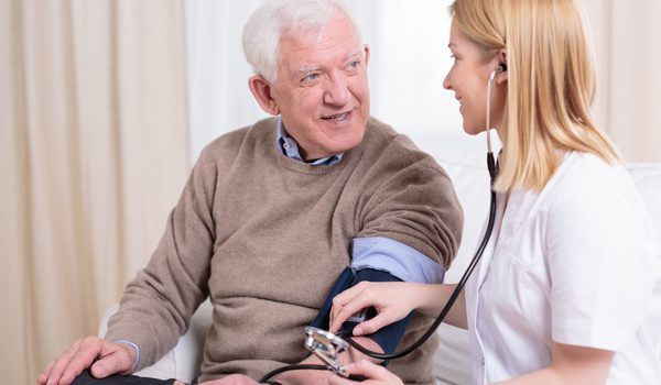 caregiver-checking-the-hypertension